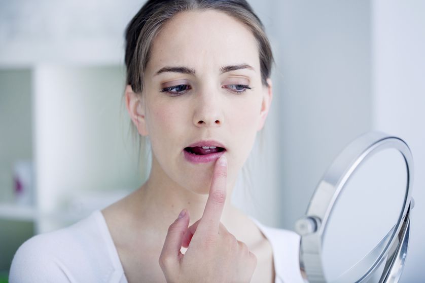 woman_applying_lip_product