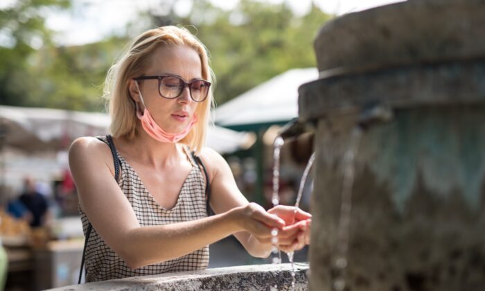 woman_drinking_water_from_public_fountain_on_hot_summer_day_700x420